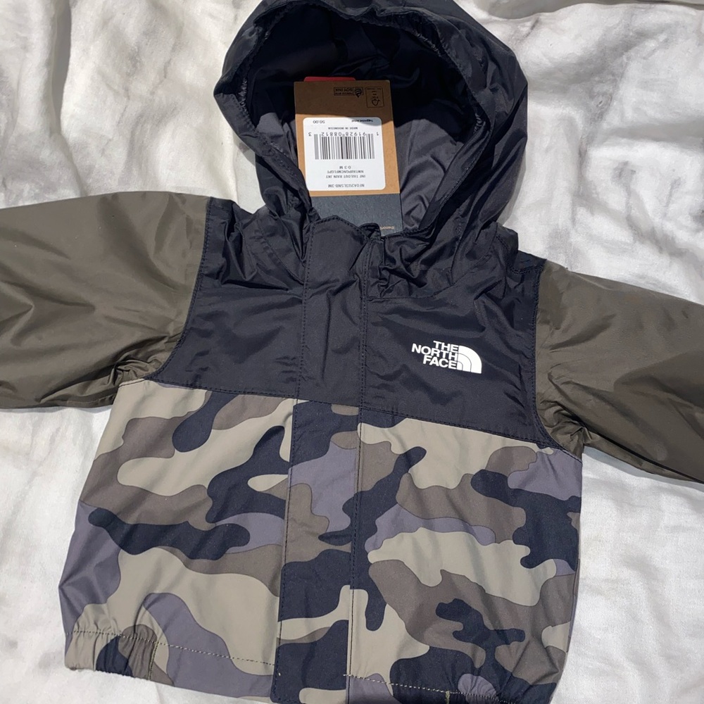 North Face rain jacket 0-3m NWT